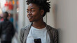 Beautiful young black woman using smartphone on the city street