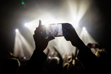 Wall Mural - Video recording of the concert on a mobile phone or a smartphone