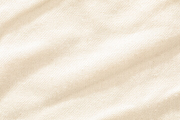 Wall Mural - Close-up of a beige fabric showcasing its woven texture and smooth surface.