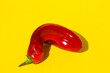 red pointed pepper on a yellow background,