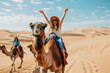 © Gita - Happy woman tourist, close up portrait, having fun enjoying group camel ride tour in Morocco