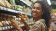 © iuricazac - A smiling woman with curly hair shopping in a grocery store aisle filled with various food items.