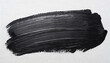Dynamic black brush stroke on a white canvas.