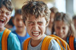 Schoolchildren laughing at crying boy, school bullying concept