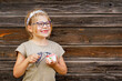 © Irina Schmidt - Little adorable preschool girl with eyeglasses eating berry and watermelon ice cream sundae in cup on sunny summer day. Happy child eat icecream dessert. Sweet food on hot warm summertime days