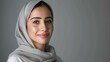Portrait of a smiling Emirati woman in traditional hijab showcasing beauty and culture