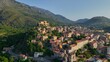 Aerial view of Corte old town, Corsica island. Morning shot of old houses on the hill in Corte village, Corsica, France