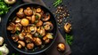 Roasted mushrooms with onion in frying pan on a dark textured background. Top vie, copy space