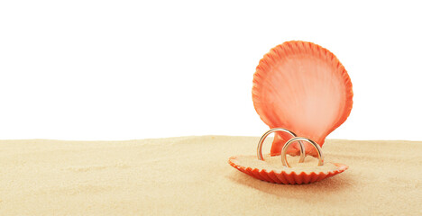 Wall Mural - Honeymoon concept. Two golden rings in shell and sand isolated on white