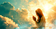 A silhouette of a woman praying at sunset, with clouds in the background.