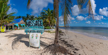 View Of Rustic Massage Sign On Beach Near Puerto Morelos, Caribbean Coast, Yucatan Peninsula, Mexico