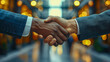 © Aliaksandra - Close-up image of two businessmen shaking hands in a cafe