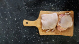 Fototapeta  - Raw chicken meat marinating on the table