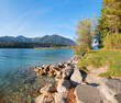 big stone blocks at lake shore Walchensee, view to Herzogstand and Heimgarten mountains