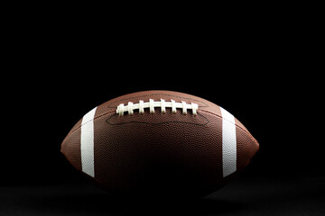 Wall Mural - brown leather football on isolated on black background