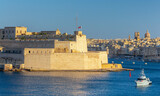 Fototapeta Boho - Old forts on the stone city wall above Valletta Bay.