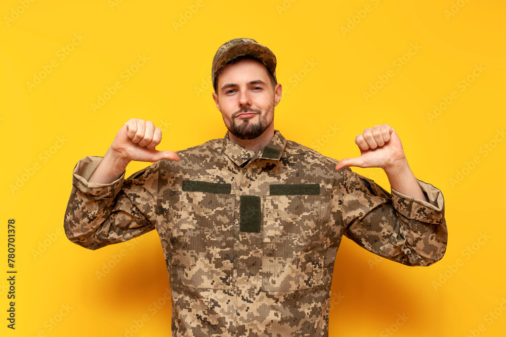 proud confident young Ukrainian army soldier in pixel camouflage ...