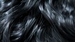 Detailed view of glossy black hair with shimmer highlights, focusing on the intricacy of the strands and their natural flow