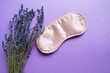 Healthy sleep concept. Relax composition with sleep mask and lavender flowers