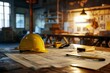 a yellow construction helmet rests atop a set of blueprints, surrounded by various architectural tools and building plans

