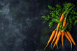 Fresh Organic Carrots with Green Tops on a Dark Background
