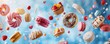 Collection of many flaying donut, cupcake and other sweet cake on blue background, bakery concept.