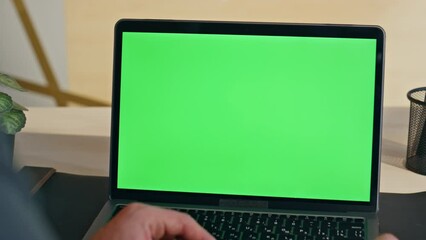 Wall Mural - Boss hand swiping touchpad on chromakey laptop starting lesson at home zoom on