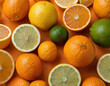 © Roman - A pile of oranges and limes placed on top of each other in a haphazard manner