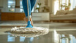 Wielding a mop, a cleaner effortlessly navigates floors, bringing back shine