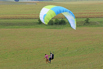 Poster - Paraglider flying from a hill	