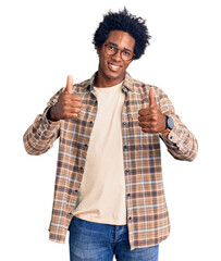 Wall Mural - handsome african american man with afro hair wearing casual clothes and glasses success sign doing p