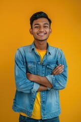 Poster - A young man wearing a denim jacket and yellow shirt. Suitable for fashion and lifestyle concepts