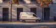 A white van parked in front of a building, suitable for transportation and logistics concepts