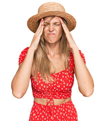 Poster - Beautiful caucasian woman wearing summer hat with hand on head for pain in head because stress. suffering migraine.