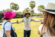 © ADDICTIVE STOCK - Tour guide explaining history at Angkor Wat temple
