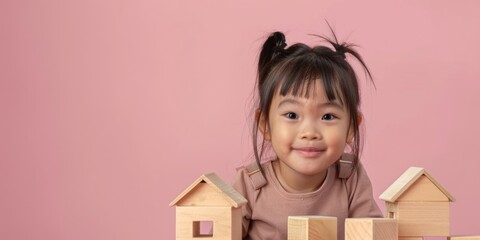 Poster - A little girl playing with wooden blocks, suitable for educational concepts