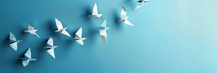 a flock of origami birds flying in formation signifies unity and leading change, with a clear blue b