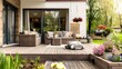 Cozy patio area with garden furniture, sliding doors and decking 