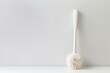 white background with a toilet brush