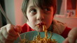 Small Boy Relishing Pasta Plate at Supper, Close-Up of 5-Year-Old Child Savoring Spaghetti Meal, Enjoying Dinner