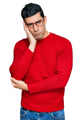 Wall Mural - Handsome hispanic man wearing casual clothes and glasses thinking looking tired and bored with depression problems with crossed arms.