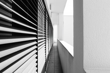 Poster - A black and white photo of a long hallway, suitable for architectural and interior design projects