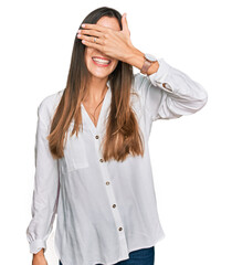 Canvas Print - Young beautiful woman wearing casual clothes smiling and laughing with hand on face covering eyes for surprise. blind concept.