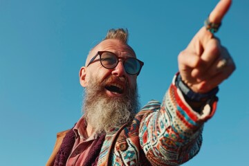 Poster - A man with a long beard pointing at something. Suitable for business presentations
