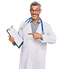 Sticker - Middle age grey-haired man wearing doctor stethoscope holding clipboard smiling happy pointing with hand and finger