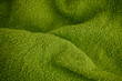Green towel texture background. Close up.