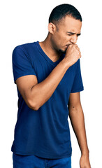 Wall Mural - Young african american man wearing casual t shirt feeling unwell and coughing as symptom for cold or bronchitis. health care concept.