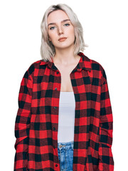 Sticker - Young blonde girl wearing casual clothes with serious expression on face. simple and natural looking at the camera.