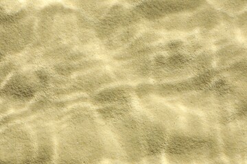 Wall Mural - Sand under water as background, top view