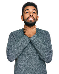 Canvas Print - Young african american man wearing casual clothes shouting and suffocate because painful strangle. health problem. asphyxiate and suicide concept.